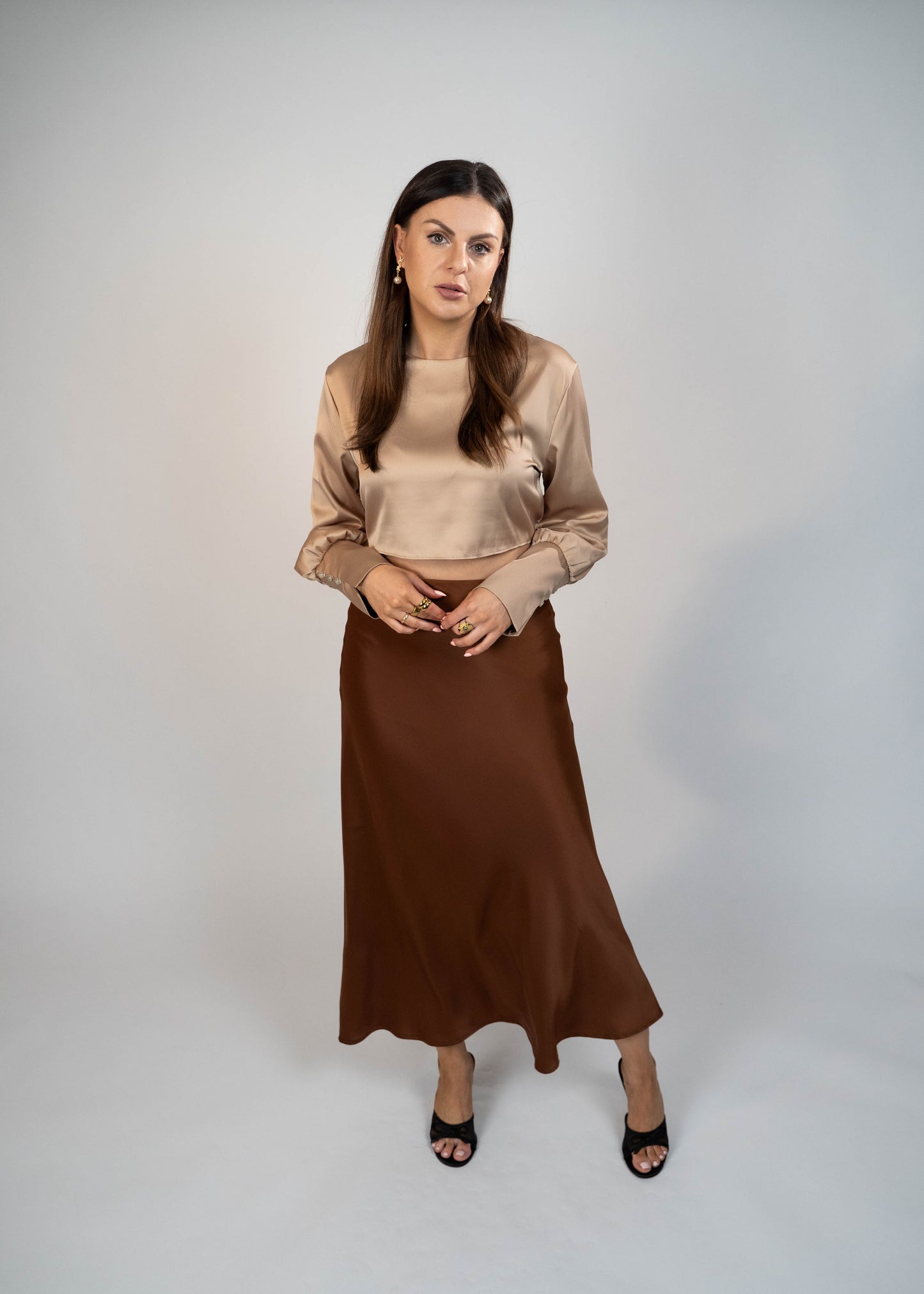 Elegant brown satin maxi skirt that’s easy to match with any outfit. Perfect for creating a sophisticated and versatile look