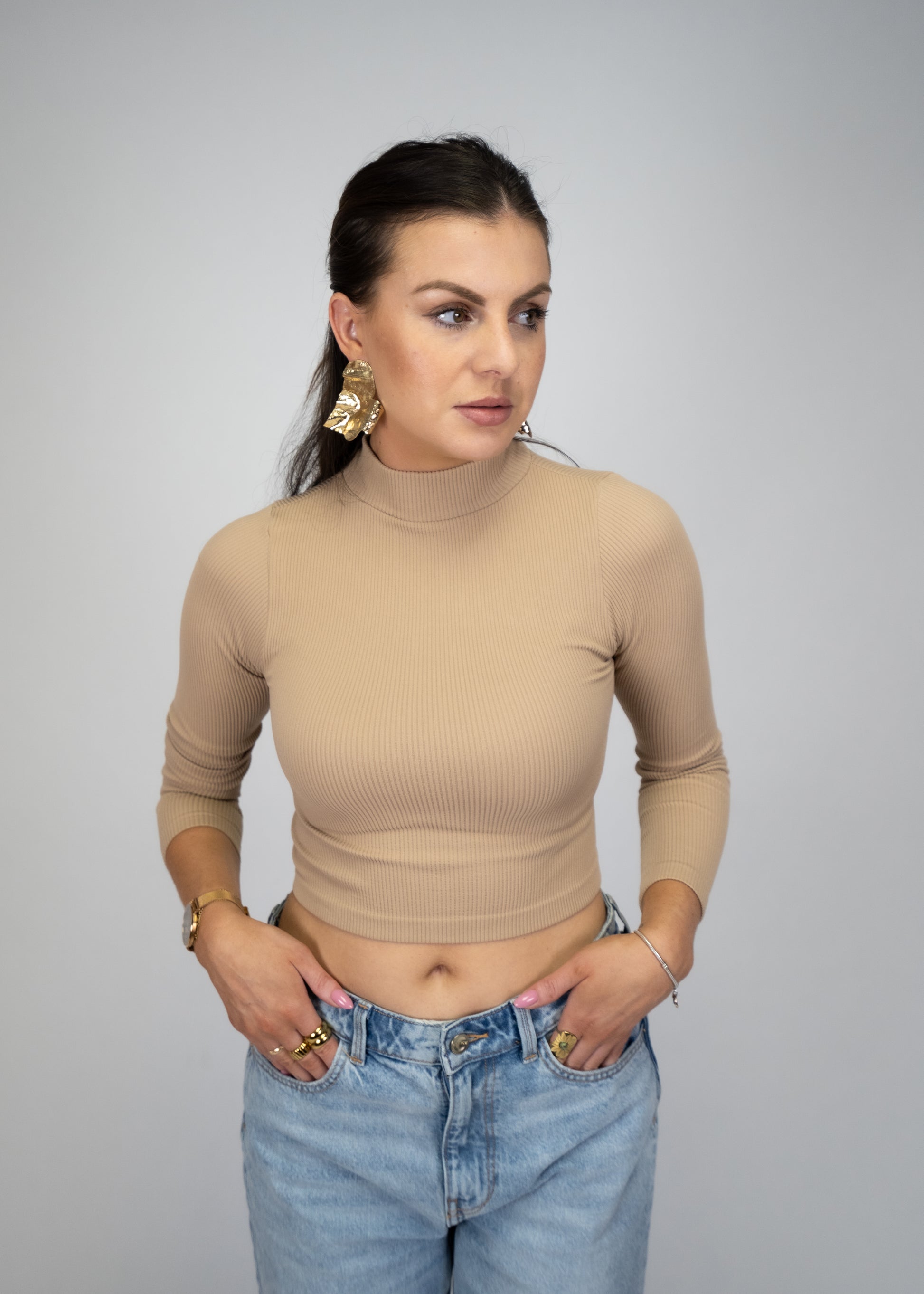 This knit seamless ribbed long sleeve turtle neck is a classic must-have, crafted from a blend of 92% nylon and 8% spandex for a contemporary fit.  Shop today for a Boho Chic and trendy