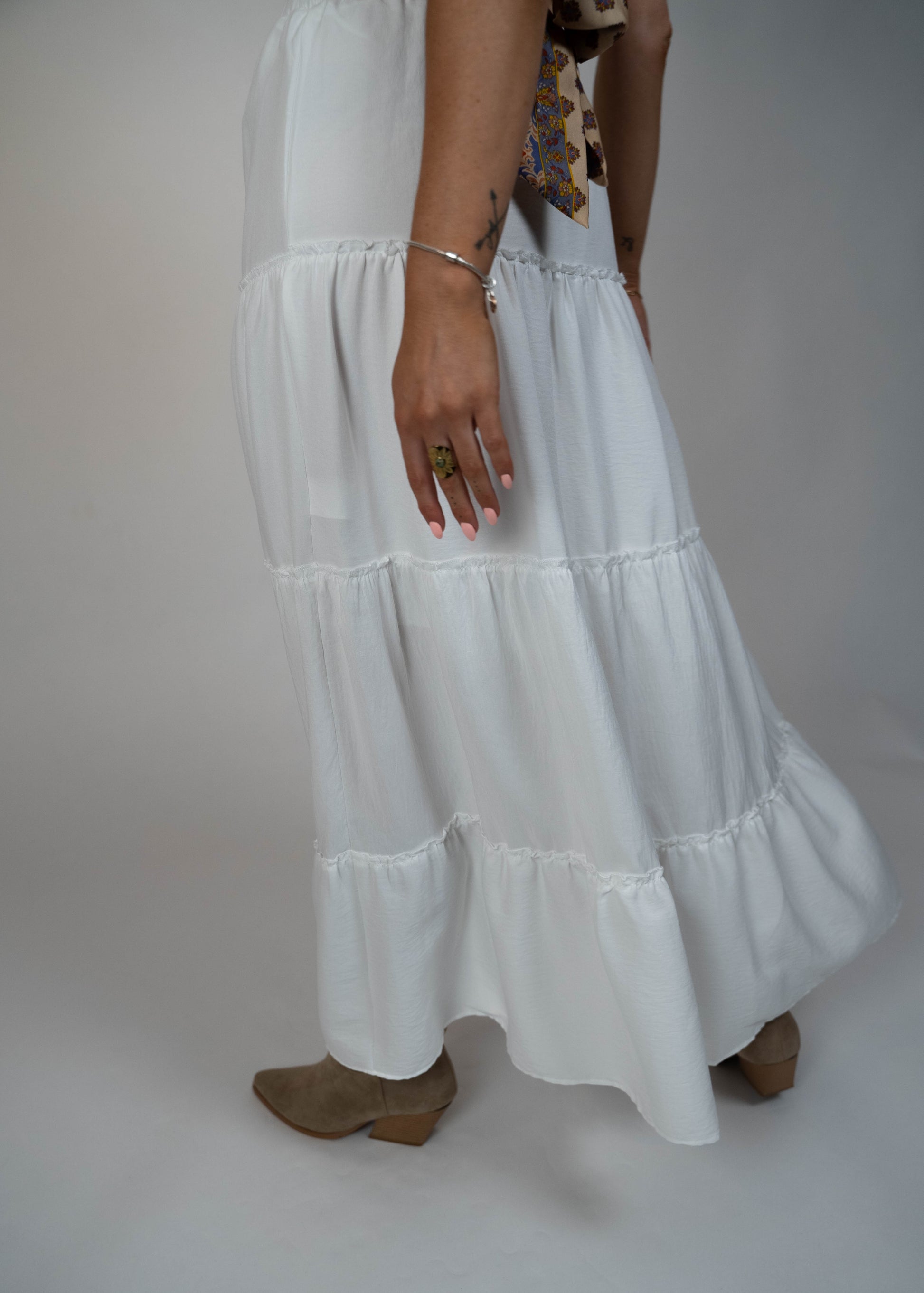 Popular maxi white skirt for this year, offering a timeless and elegant look. Perfect for creating versatile and stylish outfits