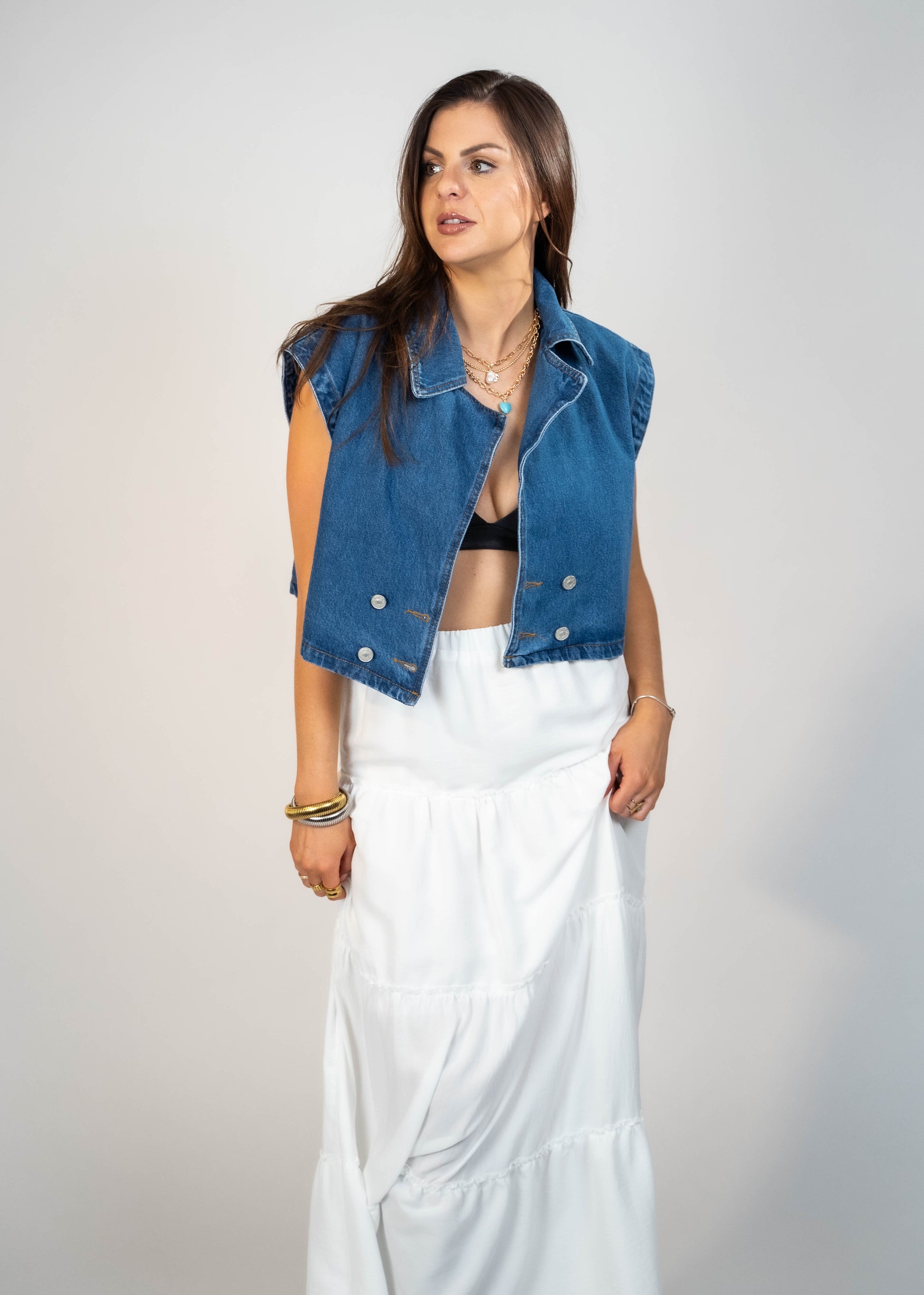 Blue loose-fit denim vest with structured shoulders, perfect for adding a relaxed and casual touch to any outfit
