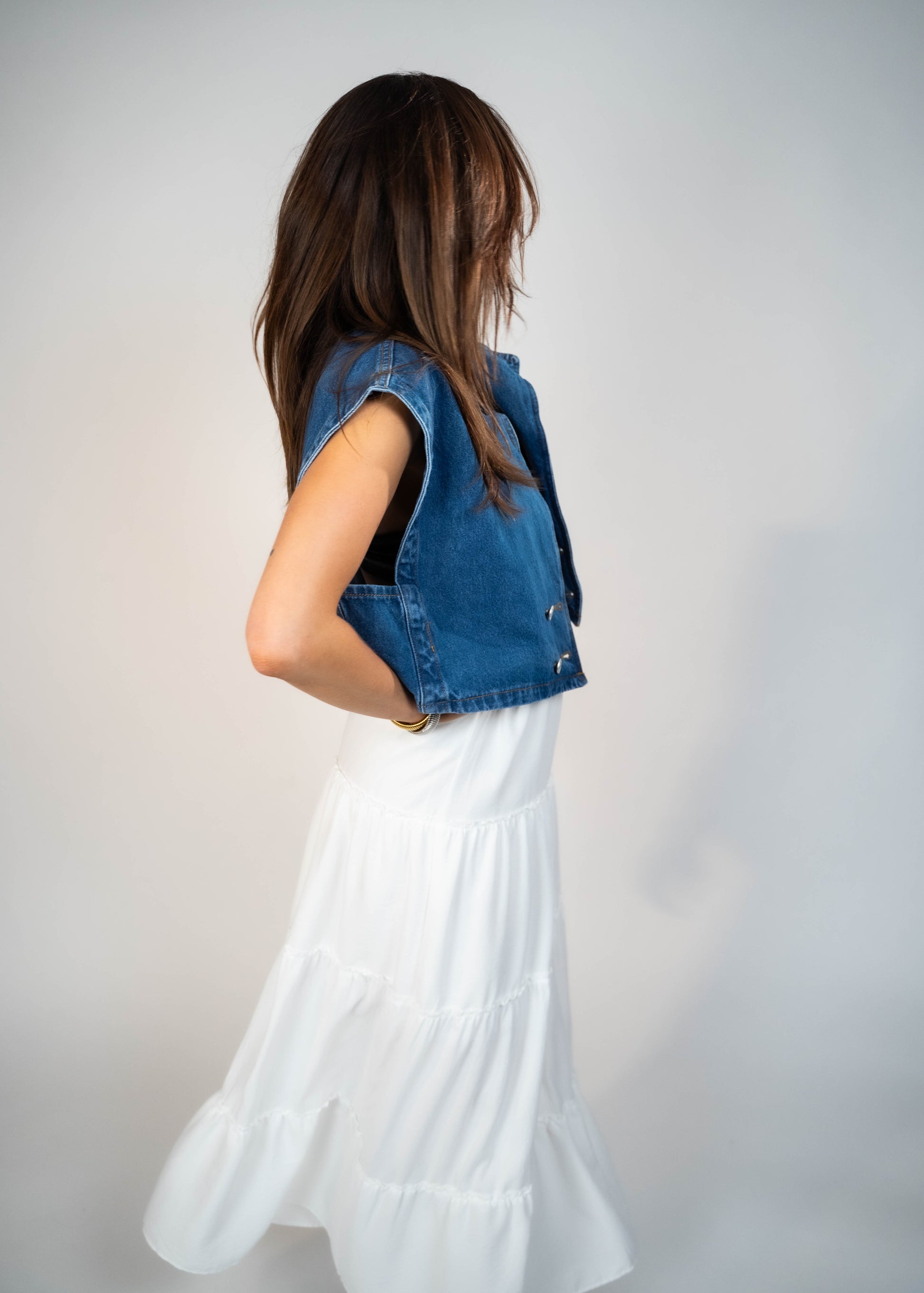 Blue loose-fit denim vest with structured shoulders, perfect for adding a relaxed and casual touch to any outfit