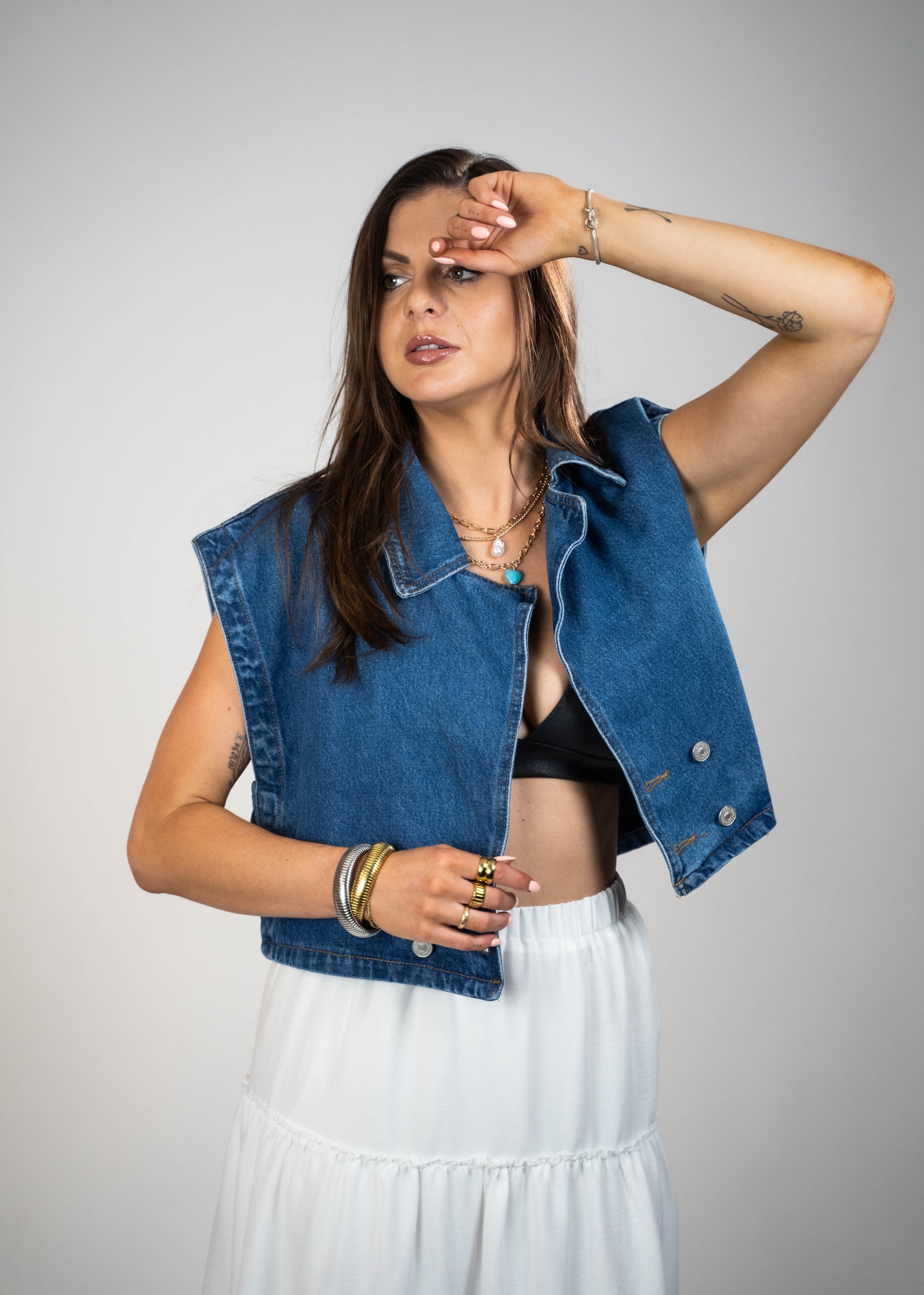 Blue loose-fit denim vest with structured shoulders, perfect for adding a relaxed and casual touch to any outfit