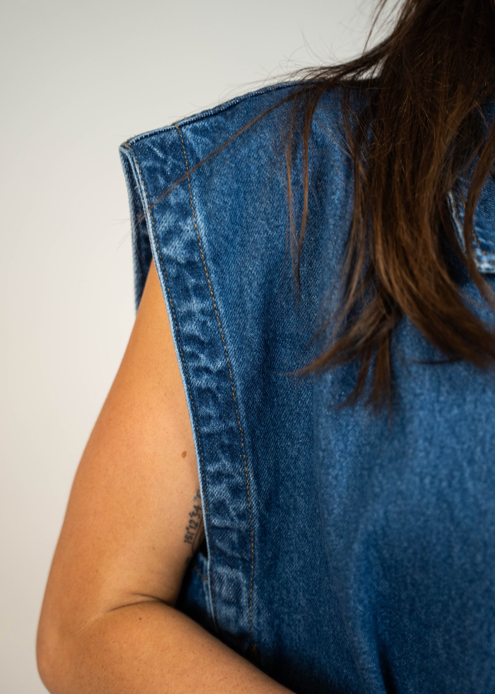 Blue loose-fit denim vest with structured shoulders, perfect for adding a relaxed and casual touch to any outfit