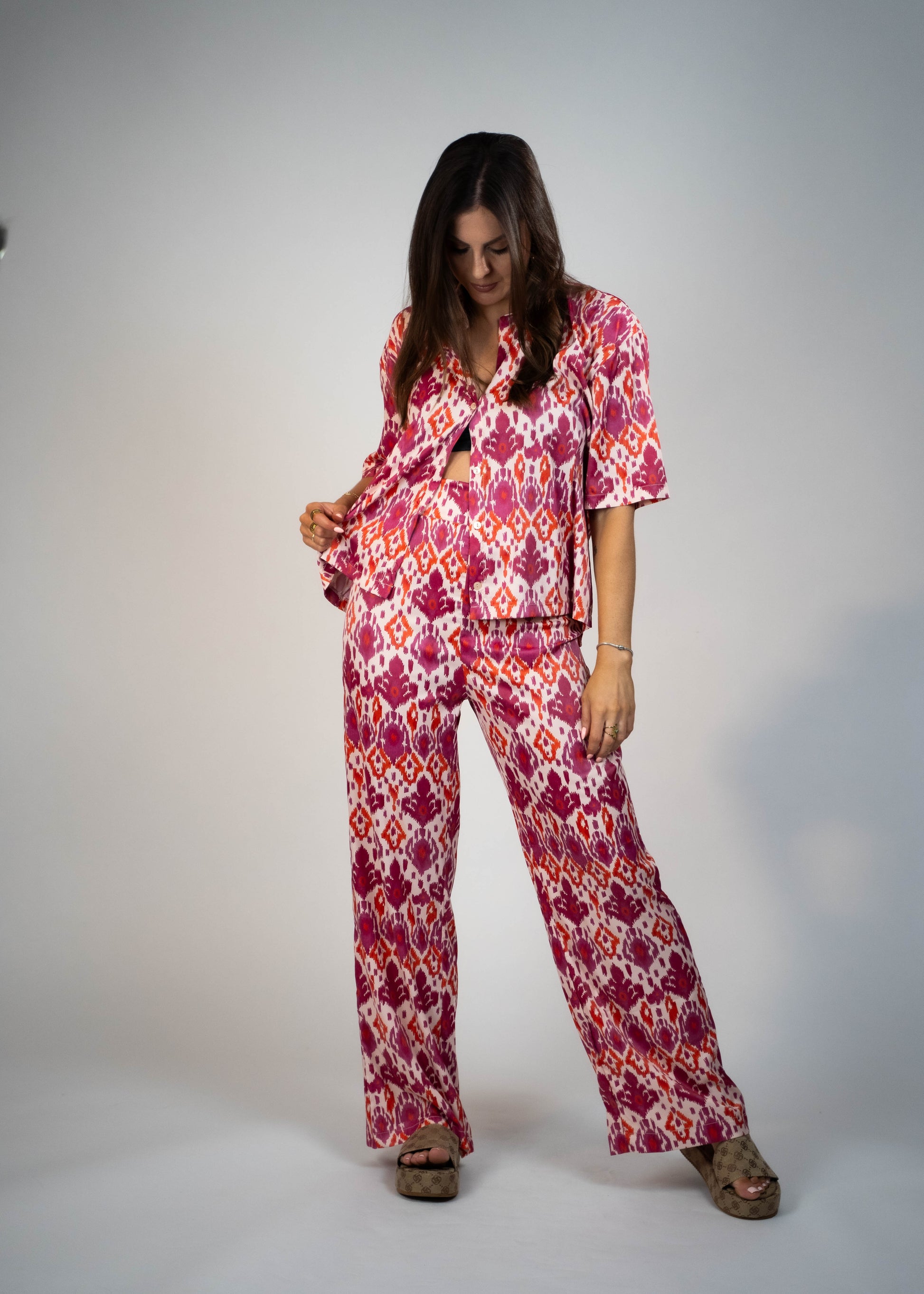 Hot pink Satin Shirt, expertly crafted for summer. Soft satin with a stylish pattern, buttondown featuring a classic collar and buttons. Elevate your summer style with this comfortable and stunning shirt