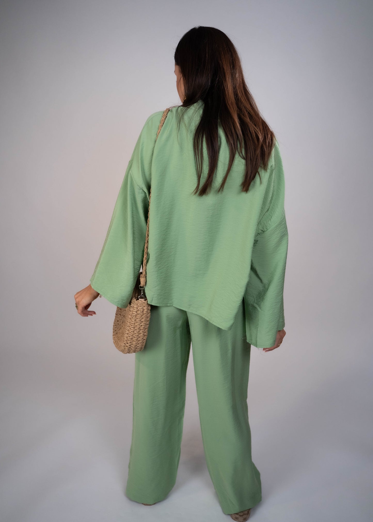 European style Palazzo Set featuring a flattering long-sleeve front-tie blouse and wide-leg palazzo pants. Made with breathable fabric, this elegant ensemble is perfect for any occasion. Elevate your wardrobe with this must-have set