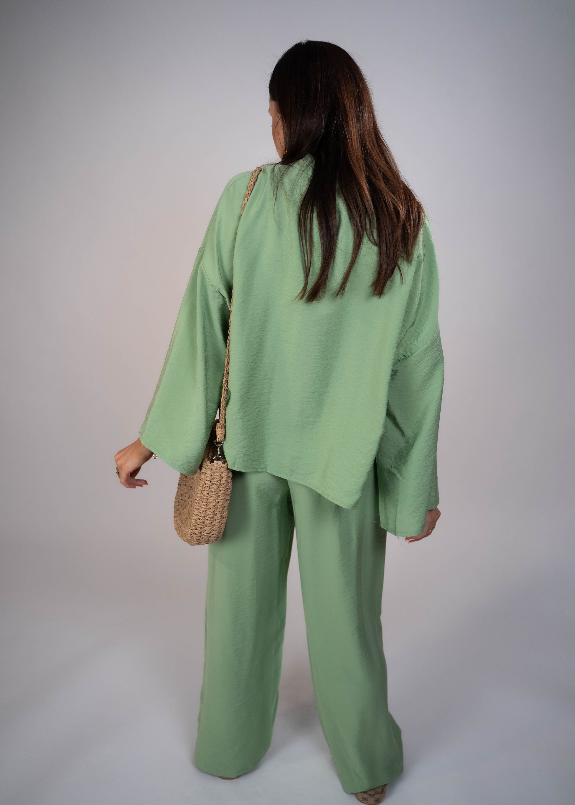 European style Palazzo Set featuring a flattering long-sleeve front-tie blouse and wide-leg palazzo pants. Made with breathable fabric, this elegant ensemble is perfect for any occasion. Elevate your wardrobe with this must-have set