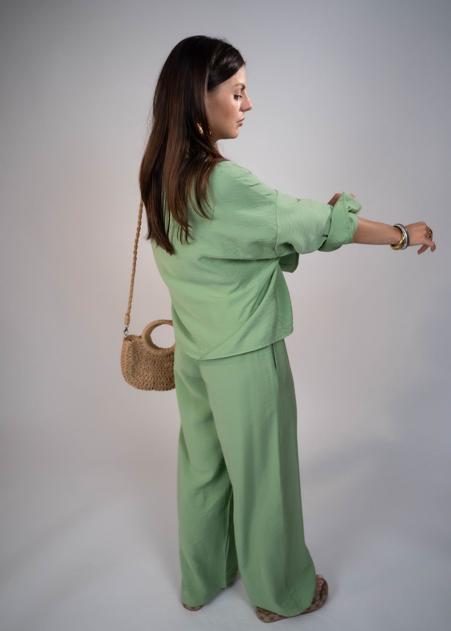 European style Palazzo Set featuring a flattering long-sleeve front-tie blouse and wide-leg palazzo pants. Made with breathable fabric, this elegant ensemble is perfect for any occasion. Elevate your wardrobe with this must-have set