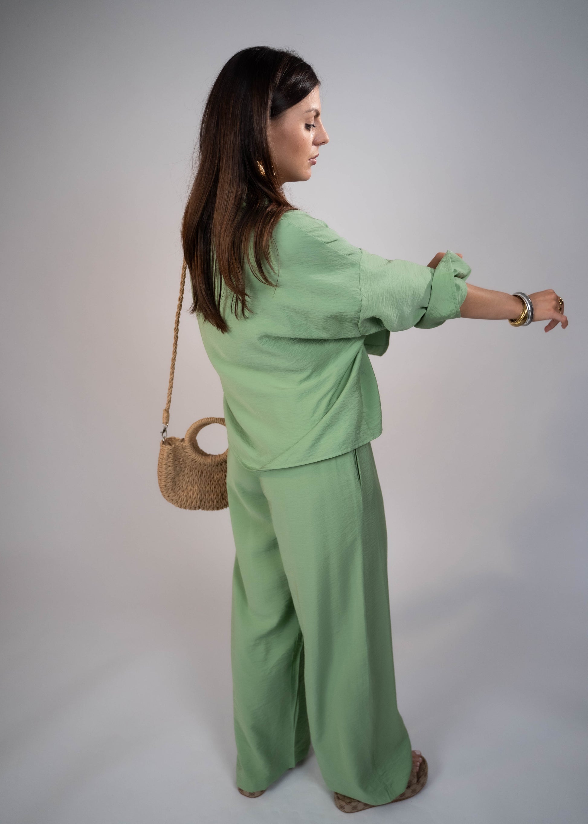 European style Palazzo Set featuring a flattering long-sleeve front-tie blouse and wide-leg palazzo pants. Made with breathable fabric, this elegant ensemble is perfect for any occasion. Elevate your wardrobe with this must-have set