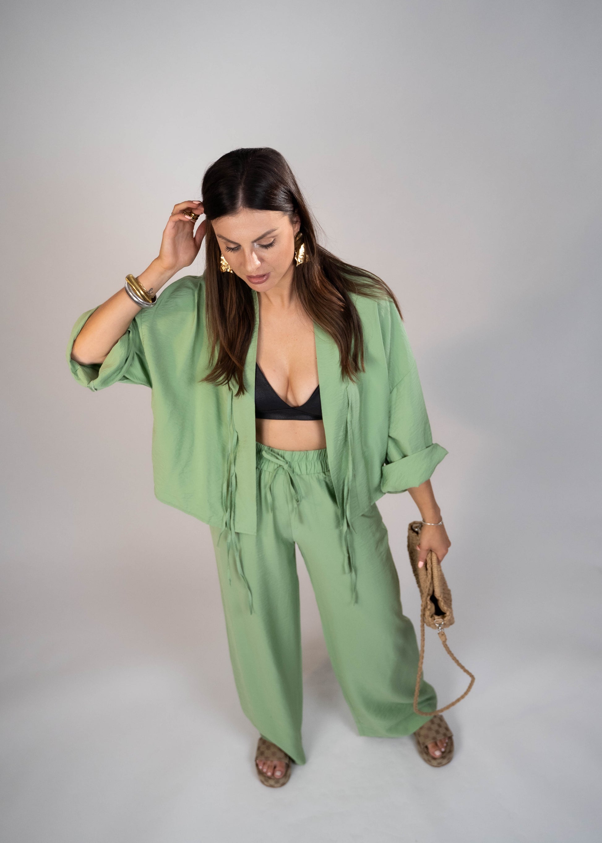 European style Palazzo Set featuring a flattering long-sleeve front-tie blouse and wide-leg palazzo pants. Made with breathable fabric, this elegant ensemble is perfect for any occasion. Elevate your wardrobe with this must-have set