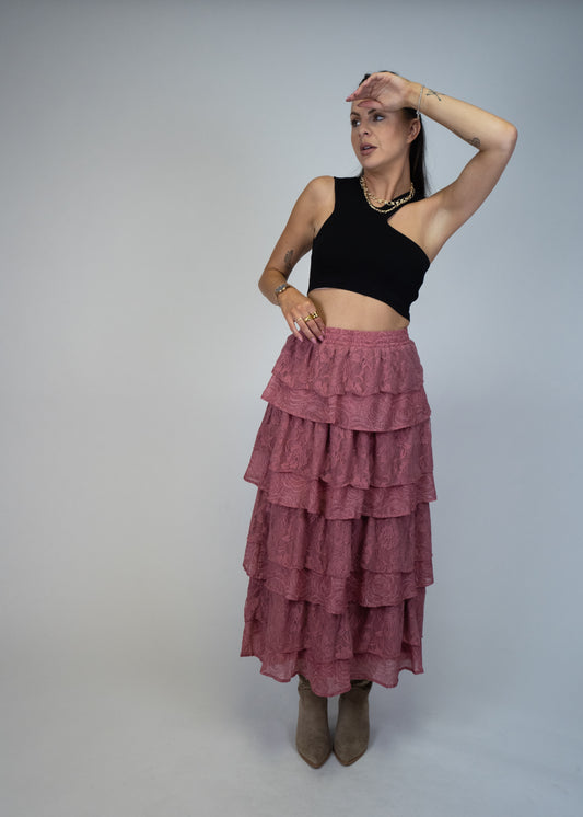 Add a touch of elegance to your wardrobe with our Lace and Rose Jacquard Ruffle Tiered Maxi Skirt. The dusty pink color exudes femininity while the ruffle tiers and jacquard fabric add texture and dimension. Perfect for any occasion, this skirt offers both style and comfort.