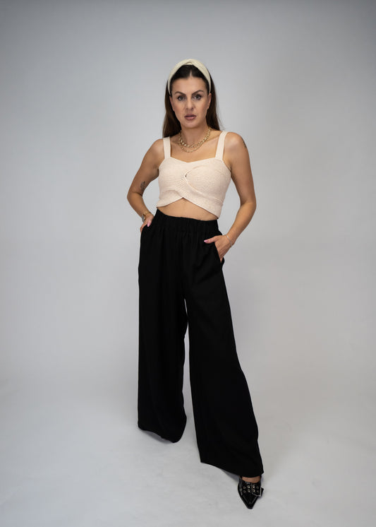 Upgrade your wardrobe with our Solid Color Elastic Waist Band Wide Long Pants. The comfortable elastic waistband ensures a perfect fit, while the wide leg design allows for easy movement. Made with high-quality materials, these pants are perfect for any occasion and provide a stylish and modern look.