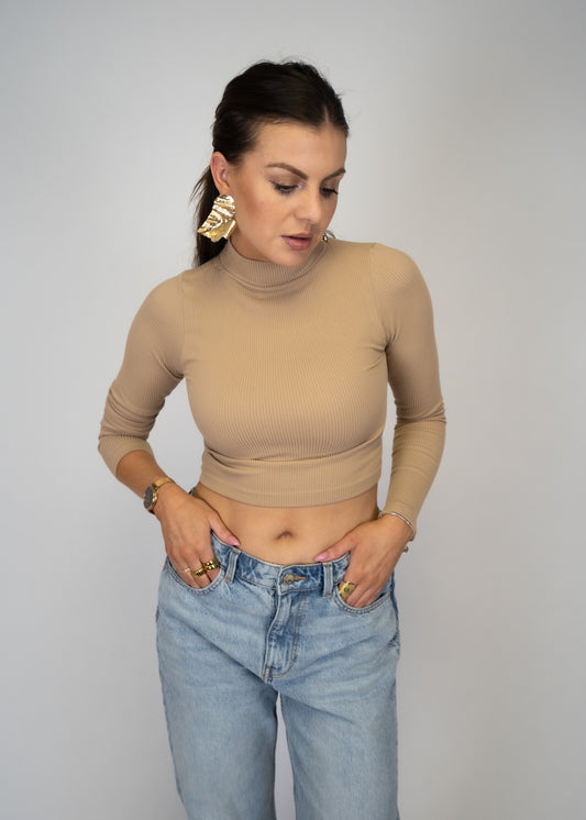 This knit seamless ribbed long sleeve turtle neck is a classic must-have, crafted from a blend of 92% nylon and 8% spandex for a contemporary fit.  Shop today for a Boho Chic and trendy